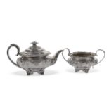 George IV teapot of ribbon fluted compressed circular form embossed and chased with shell, floral