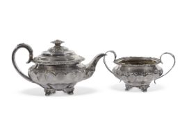 George IV teapot of ribbon fluted compressed circular form embossed and chased with shell, floral