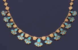 High grade yellow metal and turquoise set necklace featuring 13 turquoise set drops joined by