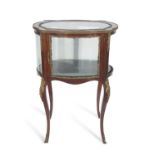Late 19th/early 20th century French mahogany and metal mounted centre display cabinet of shaped form