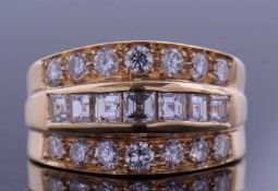 High grade yellow metal diamond cluster ring featuring a central row of square cut pave set diamonds