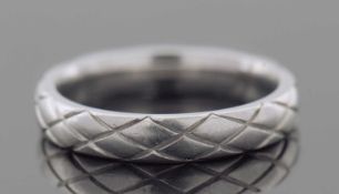 A platinum band engraved with a geo-metric design, 5.2gms finger size J