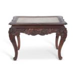 Antique Chinese hardwood and marble top table set on a carved frame with lotus flower and leaf