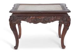 Antique Chinese hardwood and marble top table set on a carved frame with lotus flower and leaf