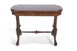 Victorian walnut veneered and inlaid card table with folding and revolving top raised on four