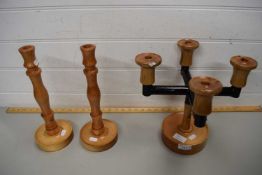 TURNED WOODEN FOUR BRANCH CANDELABRA AND A PAIR OF MODERN WOODEN CANDLESTICKS (3)