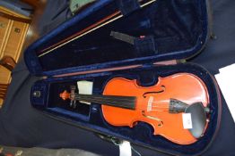 Stentor Student Mk II violin with accompanying bow and red travel case