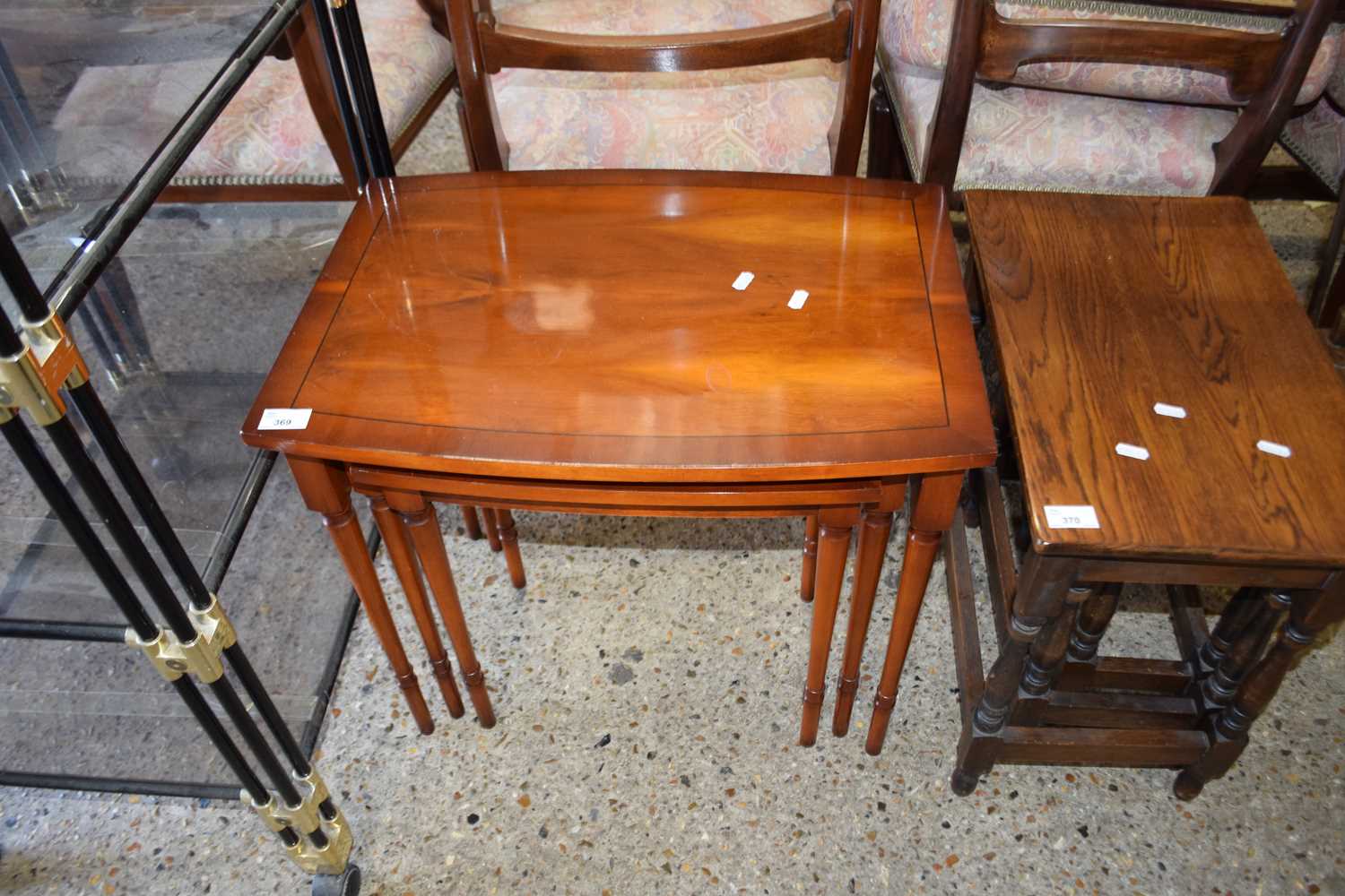 NEST OF THREE YEW WOOD VENEERED TABLES, LARGEST 58CM WIDE