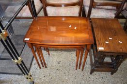 NEST OF THREE YEW WOOD VENEERED TABLES, LARGEST 58CM WIDE