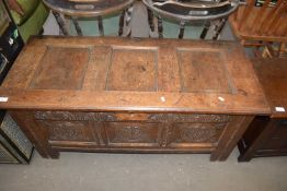 18TH CENTURY OAK COFFER WITH CARVED DECORATION TO FRONT, 122CM WIDE