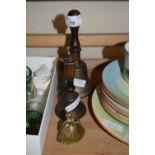 TWO BRASS BELLS WITH TURNED WOODEN HANDLES AND A FURTHER MINIATURE CRINOLINE LADY BELL (3)