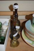 TWO BRASS BELLS WITH TURNED WOODEN HANDLES AND A FURTHER MINIATURE CRINOLINE LADY BELL (3)