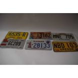 Five various American number plates