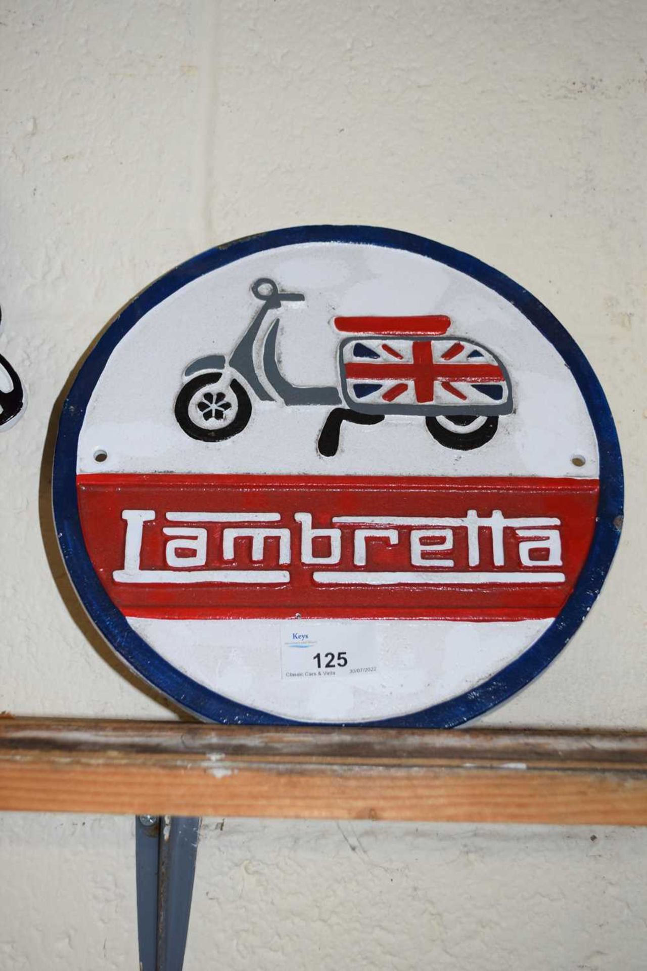 Circular cast iron wall plaque 'Lambretta'