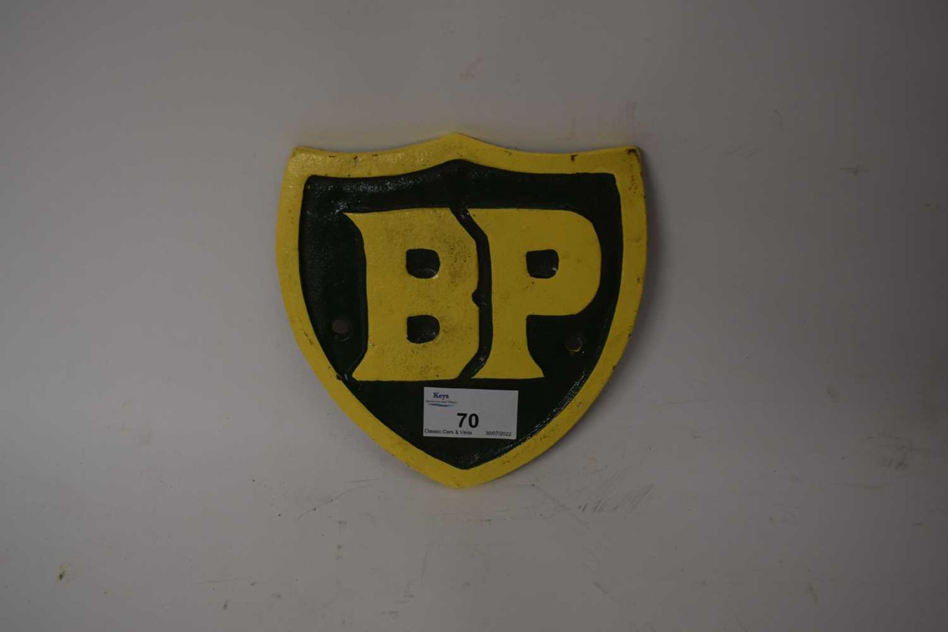 Small cast iron shield shaped advertising sign 'BP'