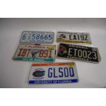 Five various American number plates