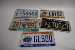 Five various American number plates
