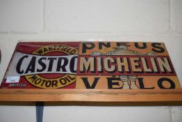Two thin metal signs 'Michelin' and 'Castrol'