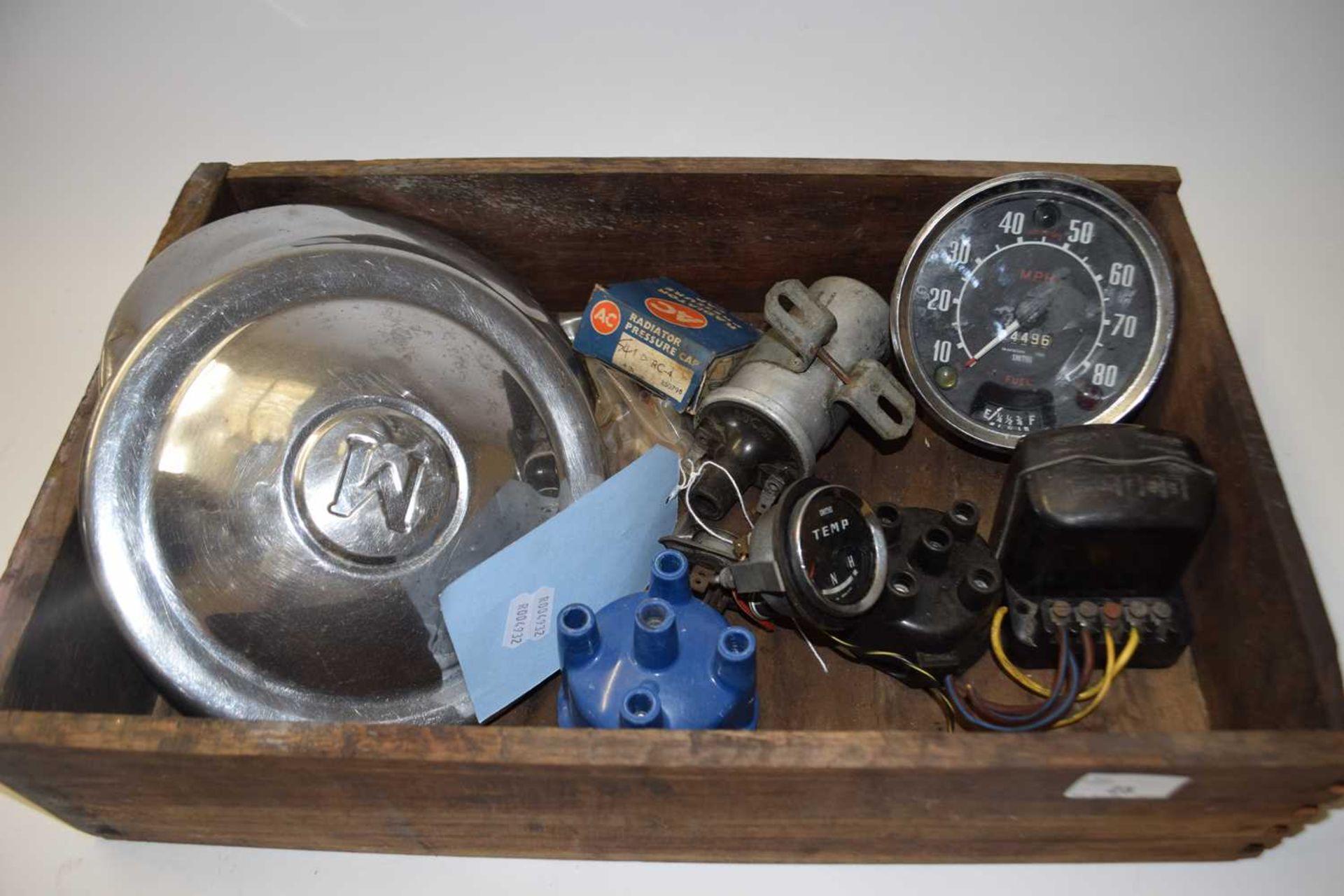 Mixed lot of car parts to include, temperature gauge, Lucas regulators, distributer caps, hub caps