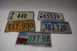 Five various American number plates