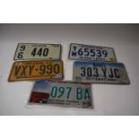 Five various American number plates