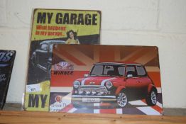 Two thin metal signs 'My Garage My Rules' and 'Monte Carlo Rally Winner'