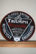 Circular cast iron wall plaque 'Triumph Motor Cycles'