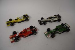 Four Mattel Formula 1 racing cars