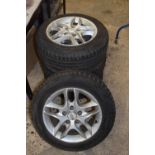 Set of four Nissan alloy wheels with 185/65 R15 tyres