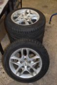 Set of four Nissan alloy wheels with 185/65 R15 tyres