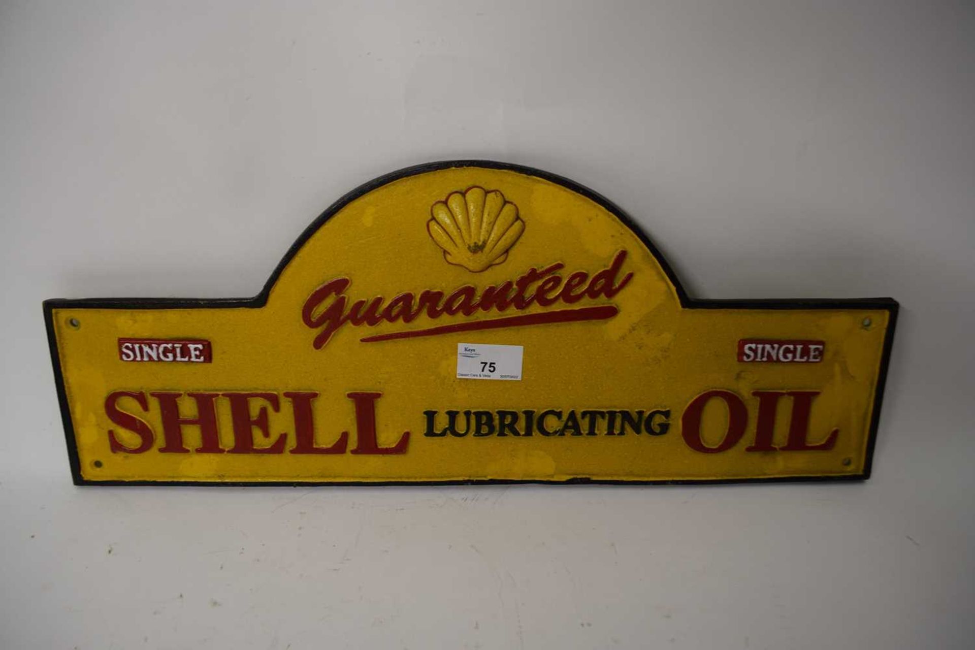Domed cast iron advertising sign 'Shell Lubricating Oil'