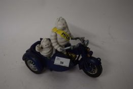 Michelin cast iron advertising figure group modelled as two figures in a motorcycle and side car