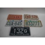 Five various American number plates