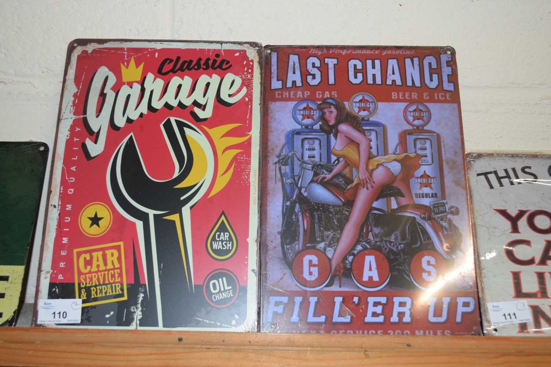 Two thin metal signs 'Classic Garage' and 'Last Chance' (2)