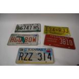 Five various American number plates