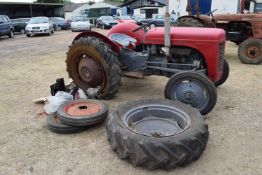 Ferguson Tractor with spare front wheels and other parts