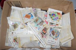 BOX CONTAINING PACKETS OF VARIOUS WORLD STAMPS