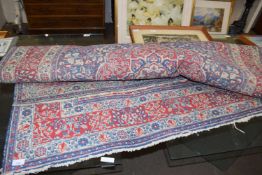 20TH CENTURY FLORAL DECORATED RUG, PRINCIPALLY BLUE AND RED