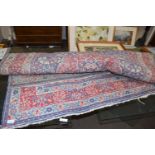 20TH CENTURY FLORAL DECORATED RUG, PRINCIPALLY BLUE AND RED