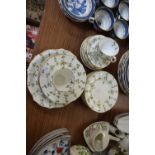 QUANTITY OF ROYAL CROWN DERBY GILT RIMMED TEA WARES DECORATED WITH FOLIAGE