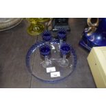 Glass circular dish, blue coloured border with four small blue coloured dishes