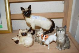 ROYAL DOULTON AND BESWICK MODEL CATS AND A FURTHER BESWICK JACK RUSSELL (5)