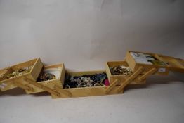 LARGE WOODEN CANTILEVER BOX OF COSTUME JEWELLERY