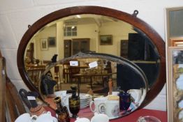 TWO OVAL BEVELLED WALL MIRRORS