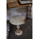 PAIR OF SMALL POLISHED ONYX PEDESTAL TABLES, 42CM HIGH