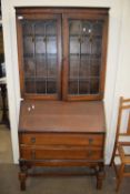 EARLY 20TH CENTURY OAK BUREAU BOOKCASE WITH LEAD GLAZED TOP SECTION