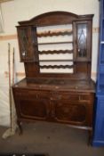 EARLY 20TH CENTURY OAK DRESSER, THE TOP SECTION WITH TWO LEAD GLAZED DOORS OVER A BASE WITH TWO
