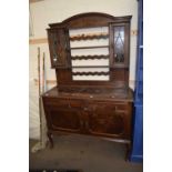 EARLY 20TH CENTURY OAK DRESSER, THE TOP SECTION WITH TWO LEAD GLAZED DOORS OVER A BASE WITH TWO