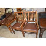 Pair of early 20th century oak carver chairs with meshed backs, 54cm wide