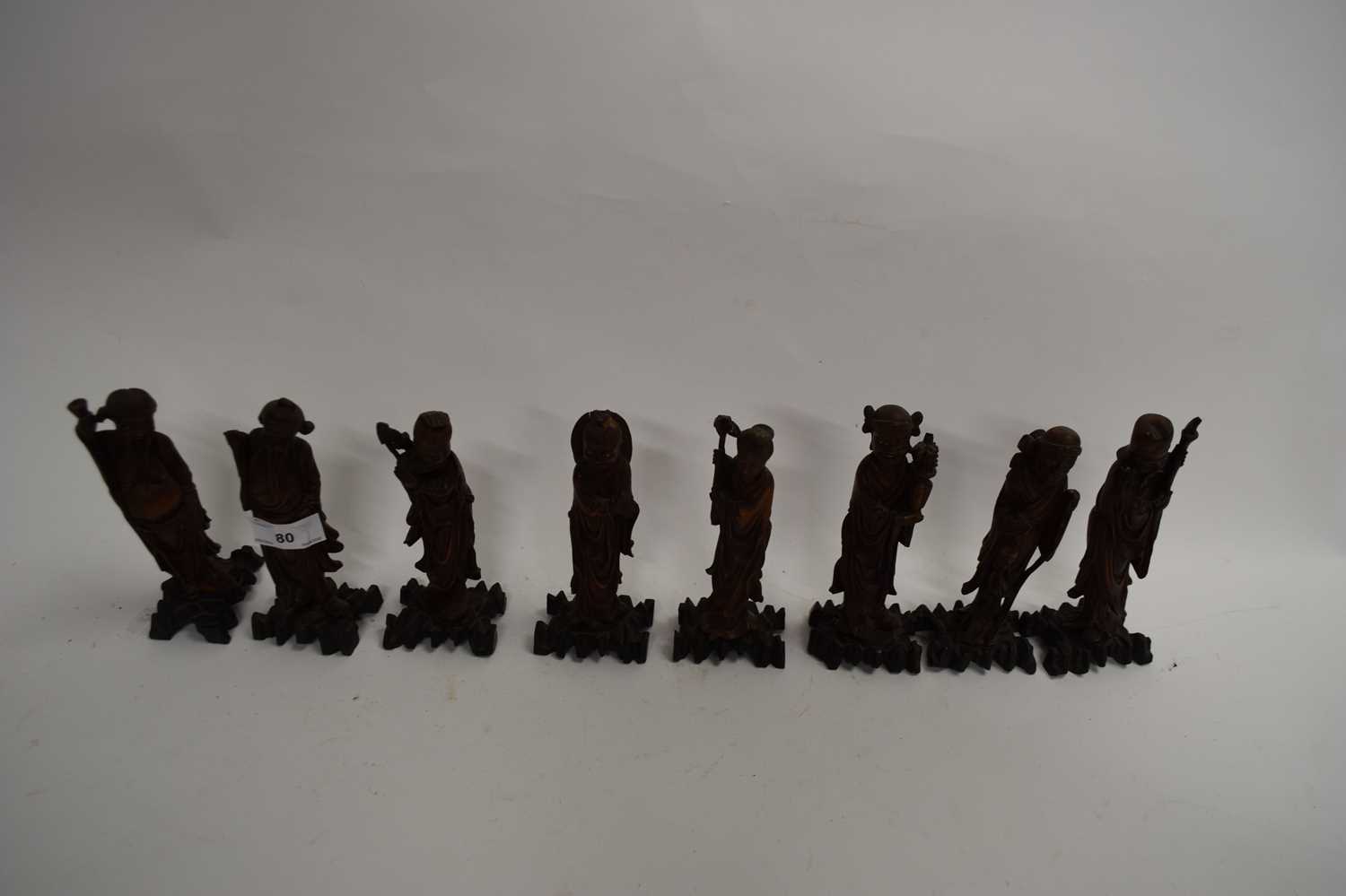COLLECTION OF EIGHT VARIOUS SMALL CHINESE HARDWOOD FIGURES, 15CM HIGH